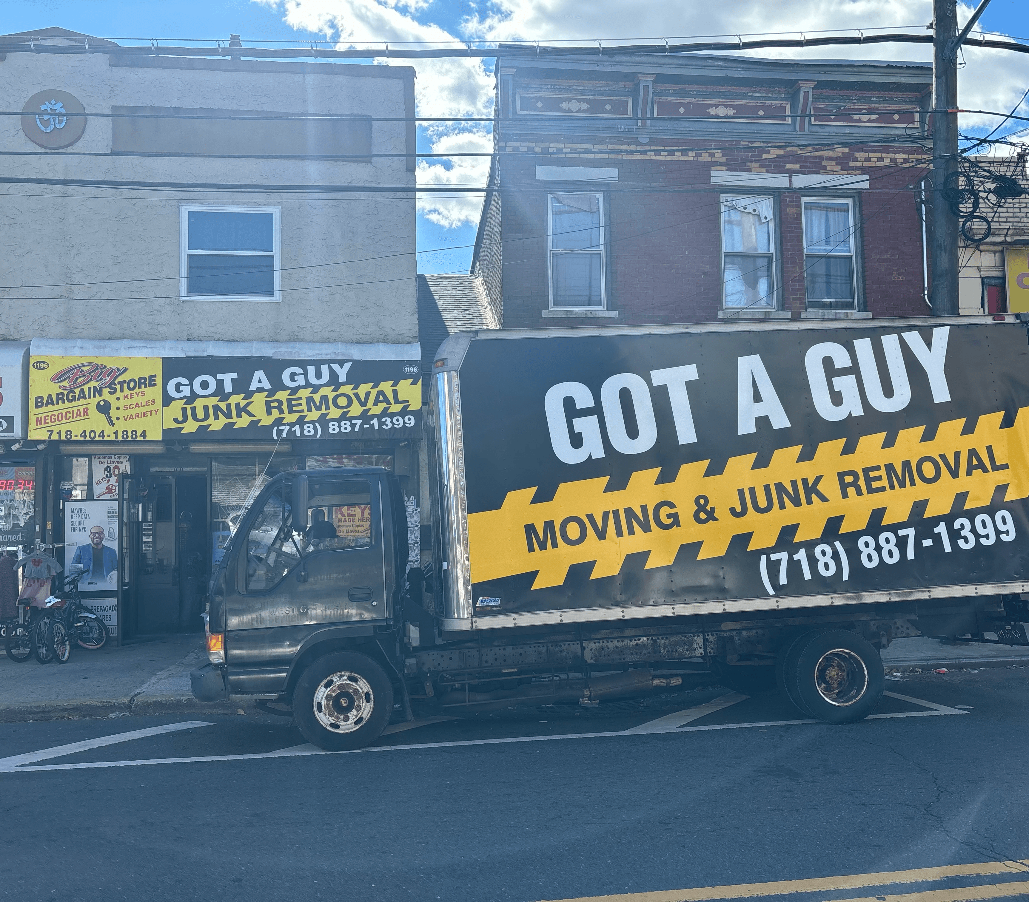 Got A Guy truck parked near a storefront for eco-friendly junk removal